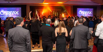 Event photograph of a corporate party used for social media sharing of photographs from the professional photography services hired for the event